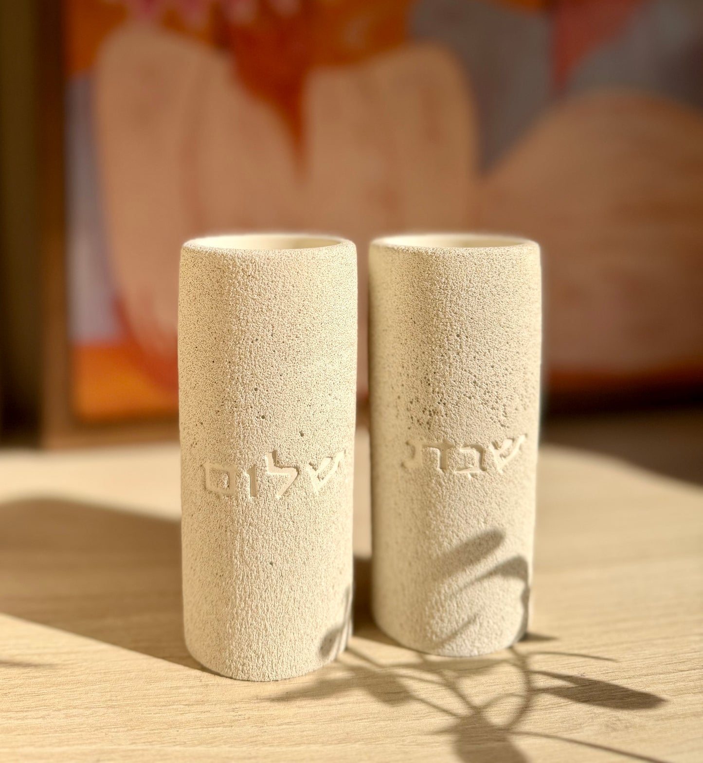 The Menuha Shabbat Candle Holders in Portland stone - fine stone finish